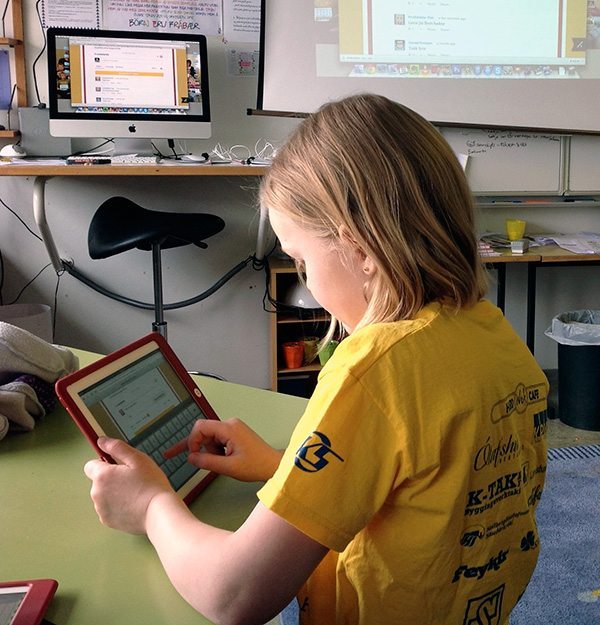 Student in Iceland using iPad