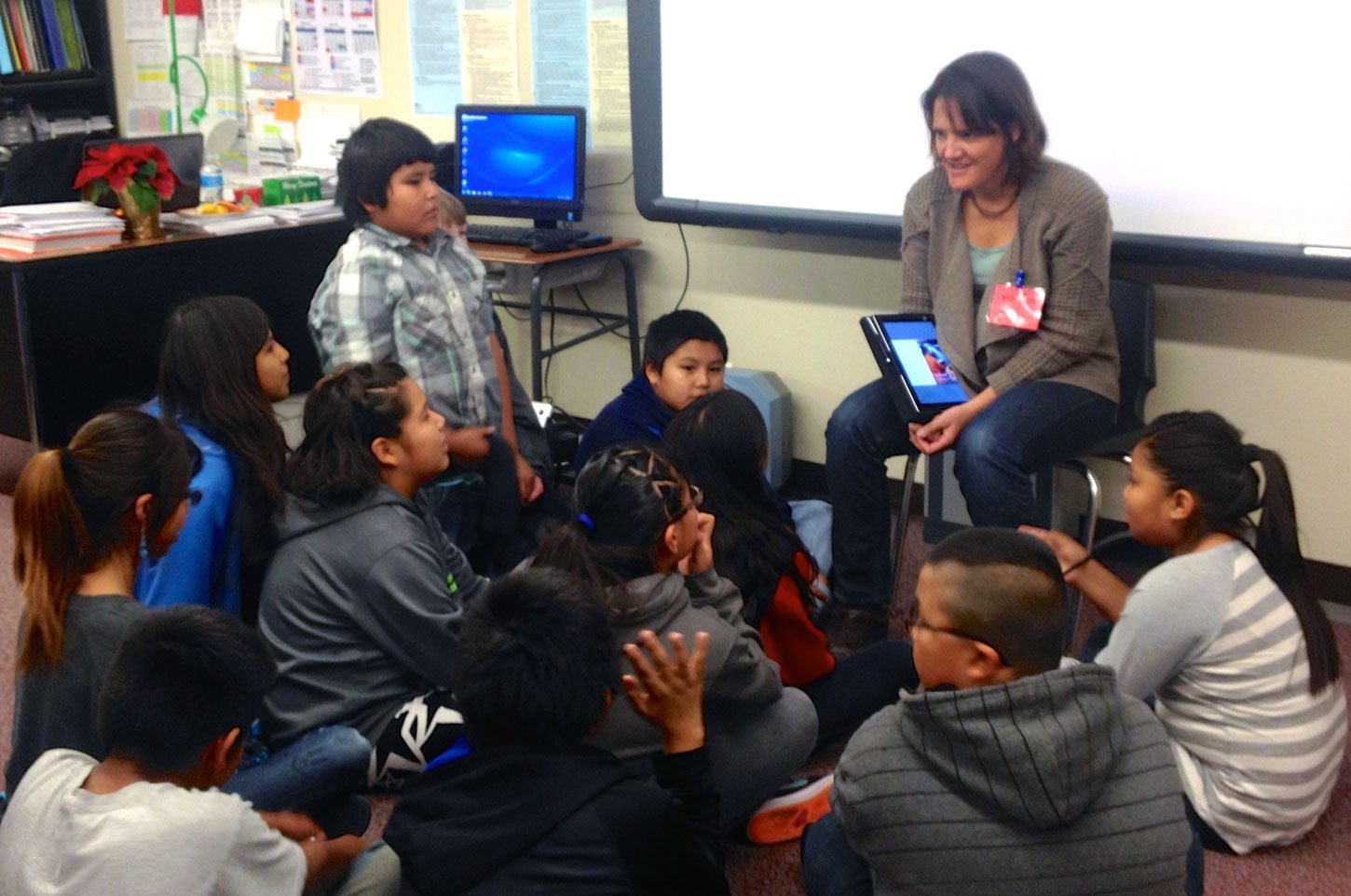 Julie Carey with students at Dzilth Na O Dith Hle Community School