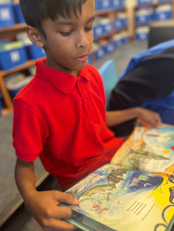 Student reading book for the very first time