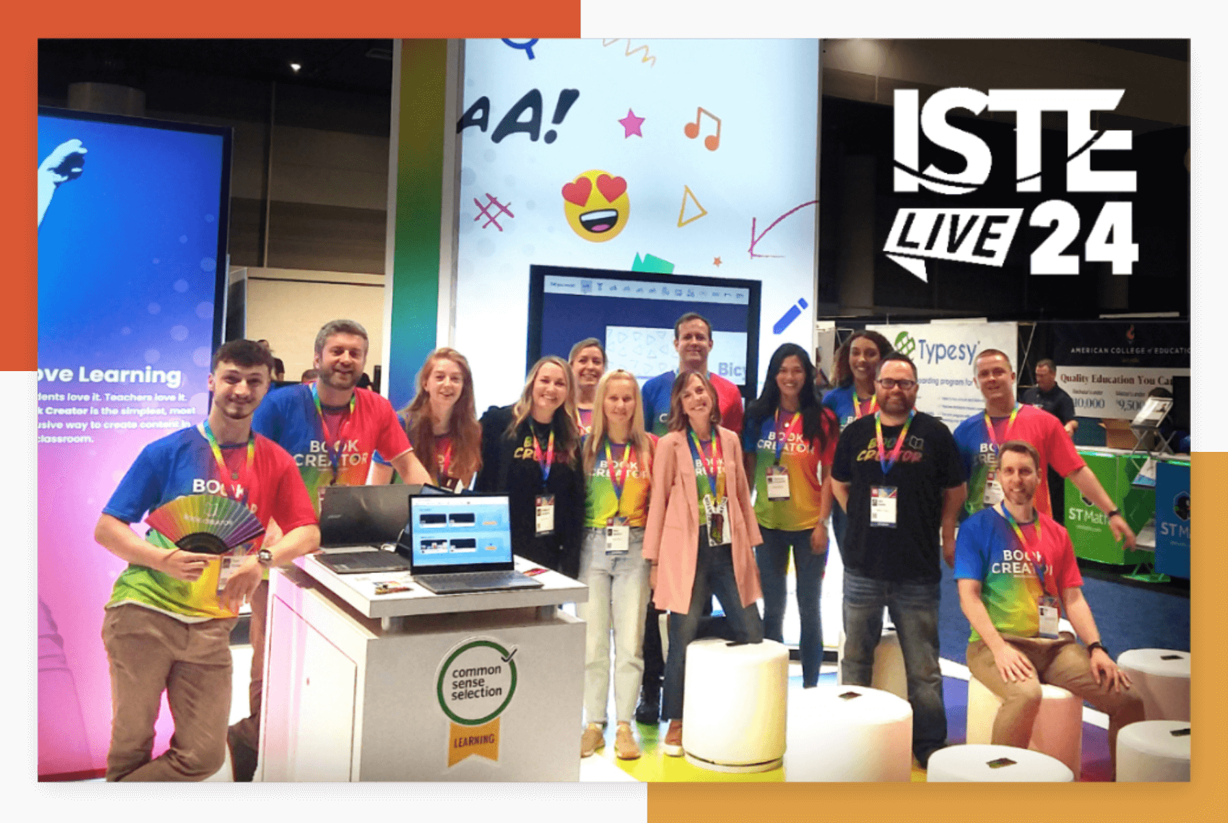 Group photo of the Book Creator team at the ISTE Live event. The team members are standing and sitting around their booth, which features colorful signage and a large digital screen displaying educational content. They are wearing vibrant, rainbow-colored Book Creator t-shirts and name badges. The booth is branded with 'Common Sense Selection' and the Book Creator logo, and the backdrop includes various educational and tech-themed decorations. The event logo 'ISTE Live 24' is prominently displayed in the top right corner of the image.