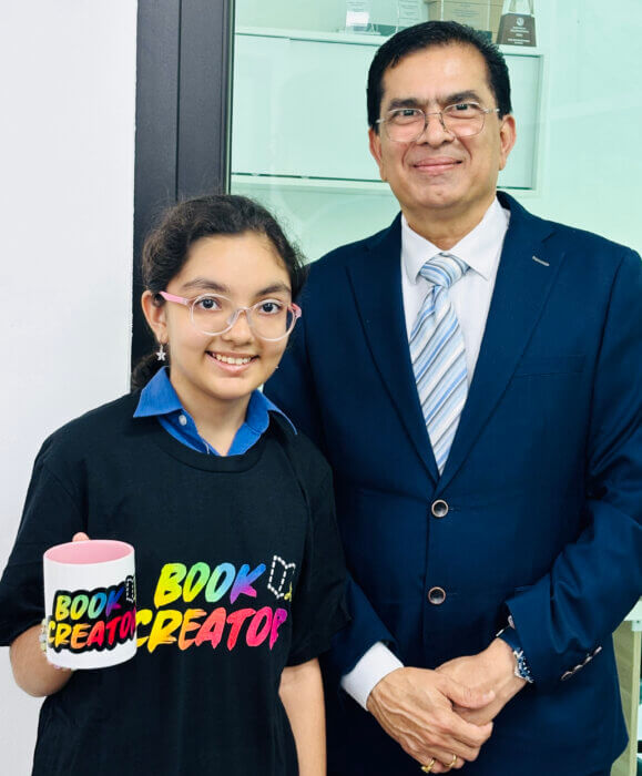 Nityashree Arora prize winner for the " Tell your Story " Competition with her prizes along with , our beloved Senior Principal Dr Kris Bhatt .NPS international School Singapore to